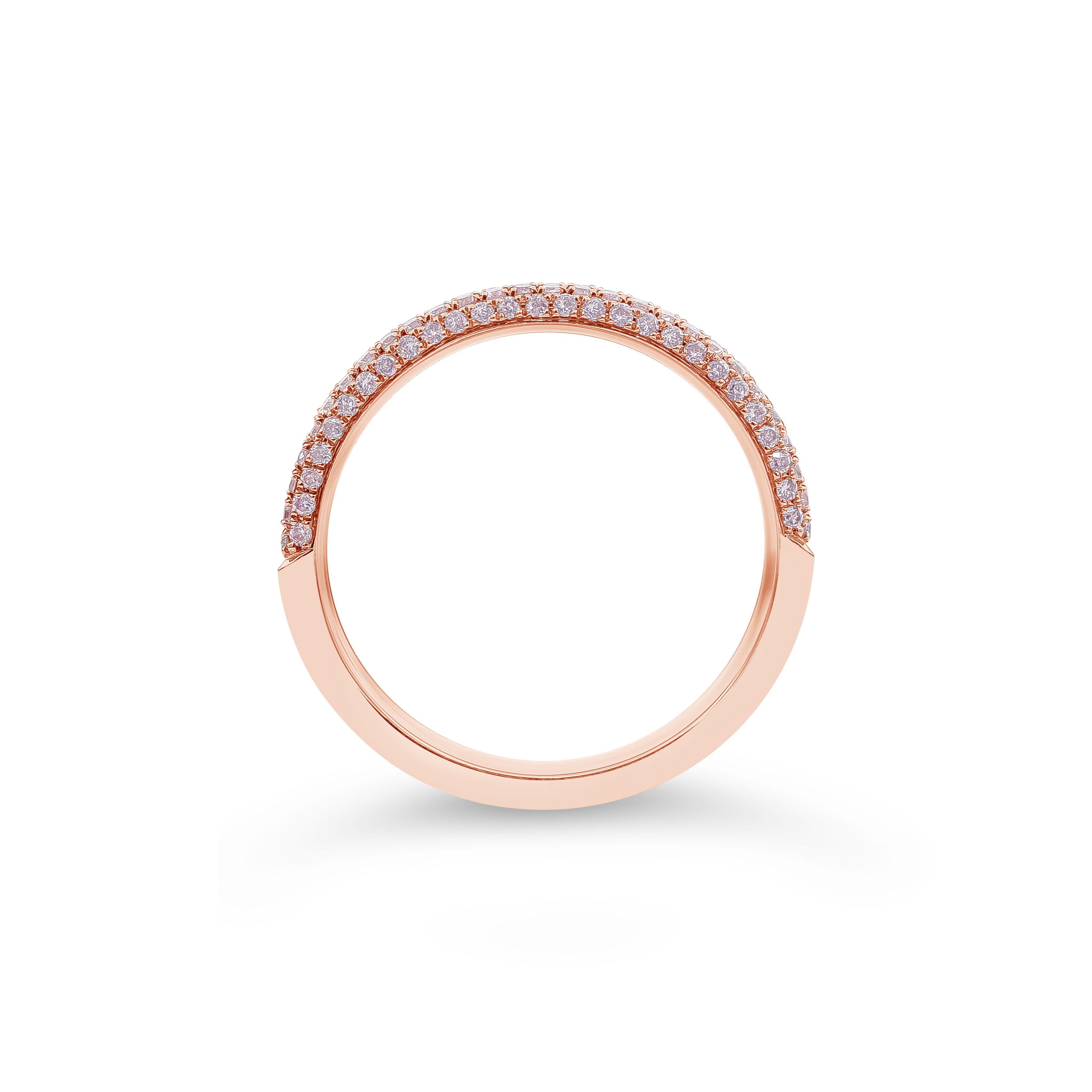 This wedding band has a rounded design micro-pave set halfway with round brilliant pink diamonds weighing 0.30 carats total. Made in 18k rose gold. Size 6.25 US (sizable upon request).

Style available in different price ranges. Prices are based on