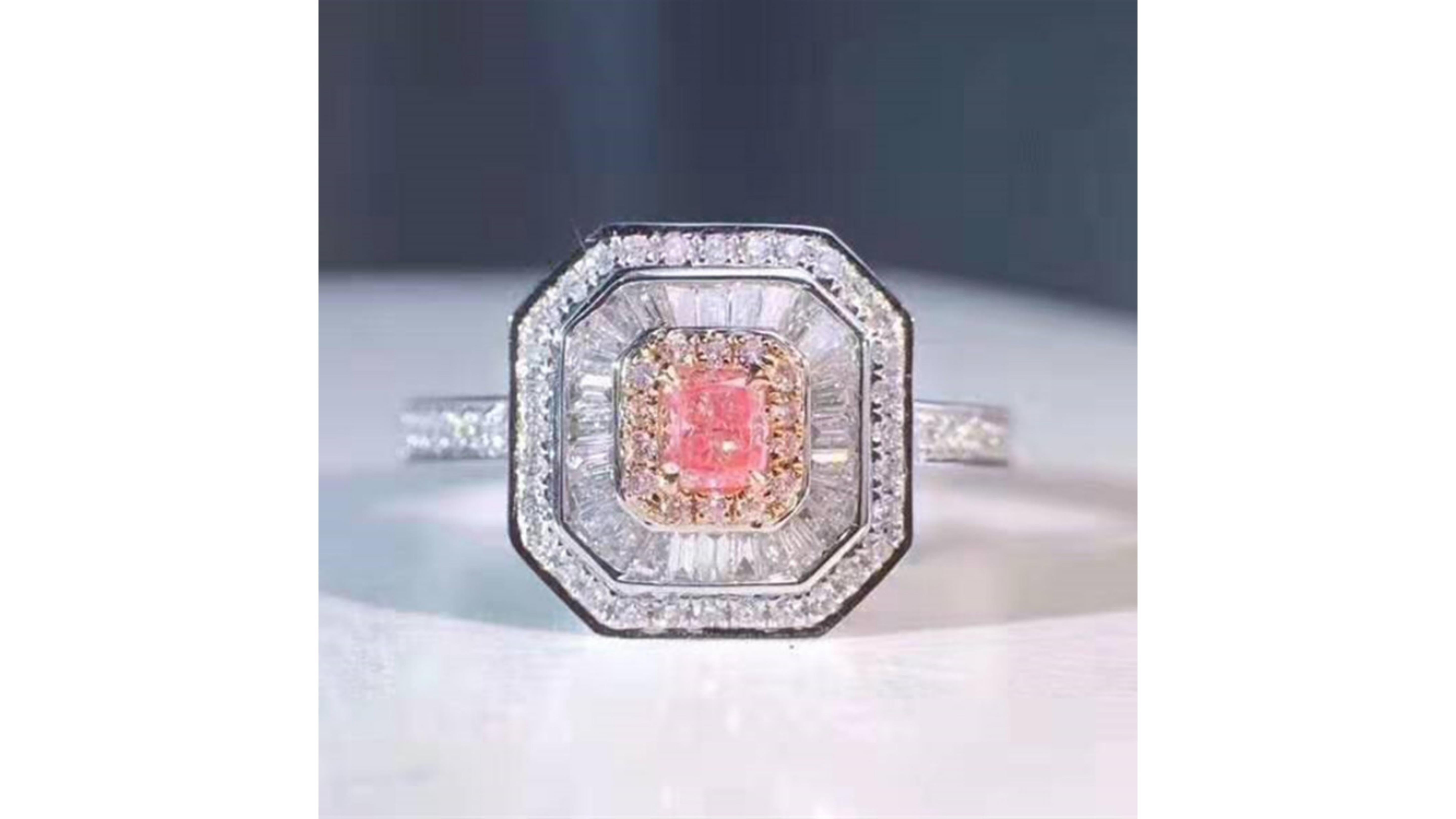 Fancy Pink Diamond Ring 18 Karat White Gold.    With 117 Diamonds this really does stand out and it has baguette diamonds around the light pink ones too.  Their scarcity and stunning beauty make natural pink diamonds incredibly intriguing. Highly