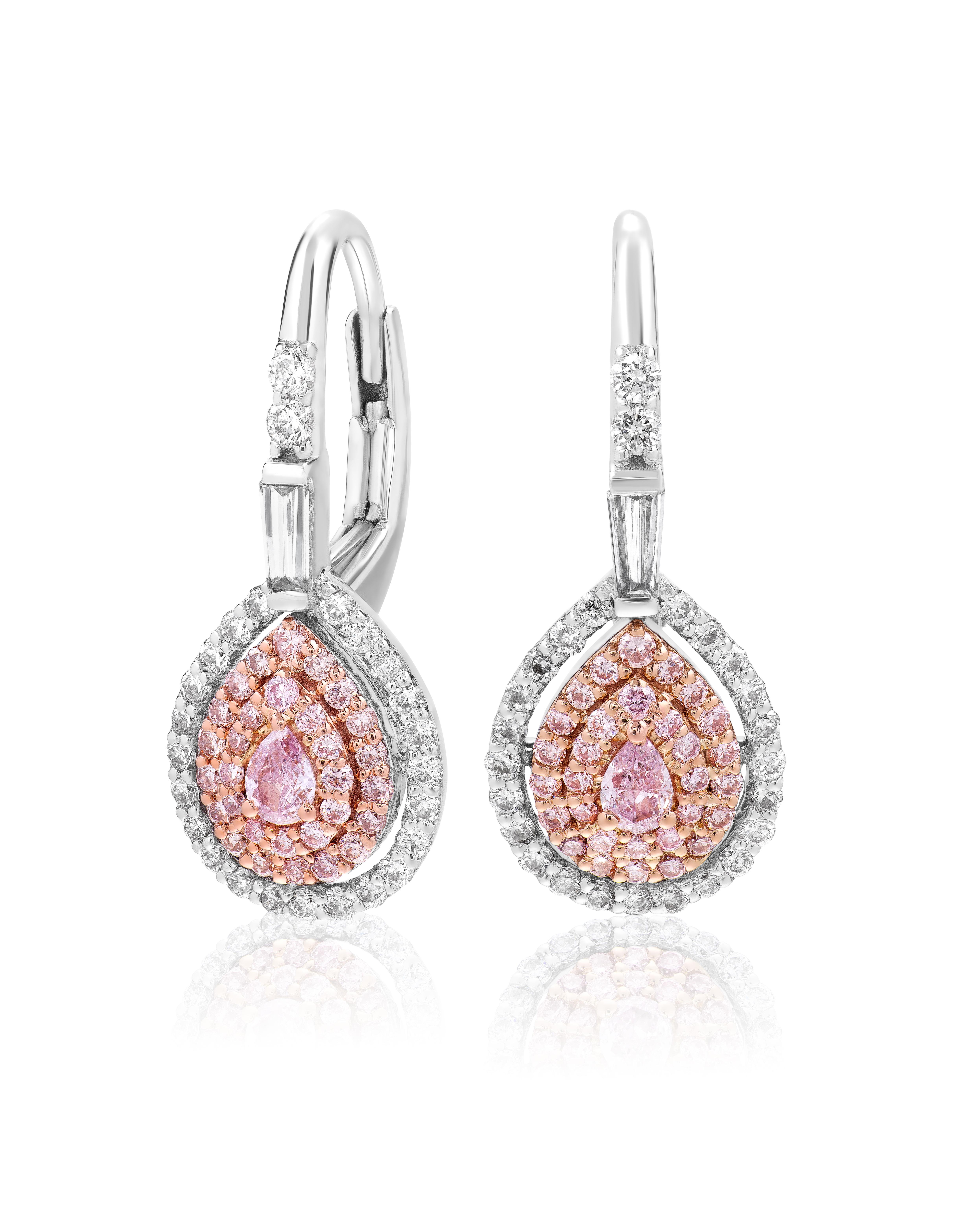These stunning fancy pink earrings are the perfect accessory to add a pop of color to any outfit. The lever back design ensures a secure and comfortable fit, while the 0.17 carat fancy pink center stones are accented by a total of 110 diamonds in