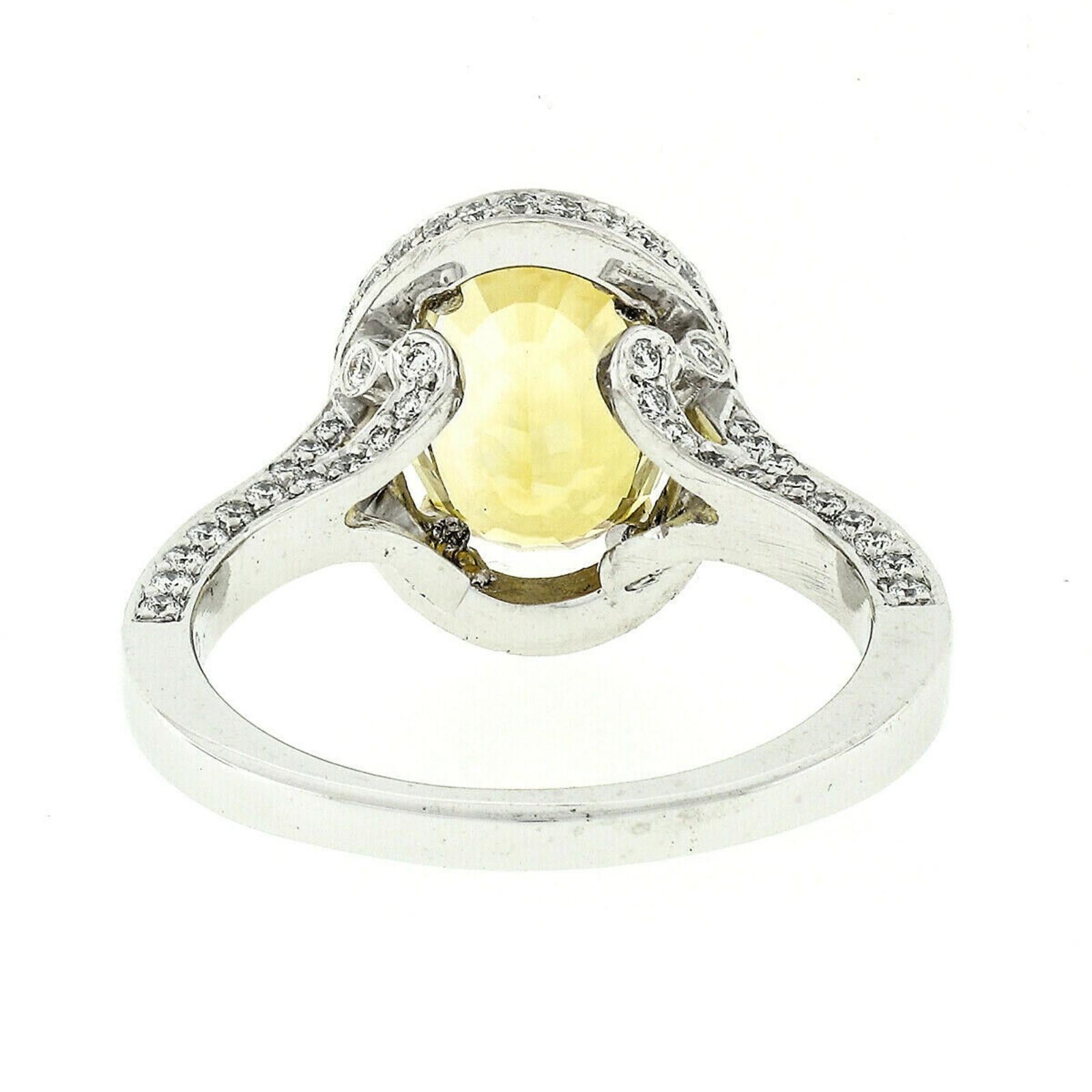 Fancy Platinum 5.6 Carat GIA Oval Yellow Sapphire and Diamond Cocktail Ring 4