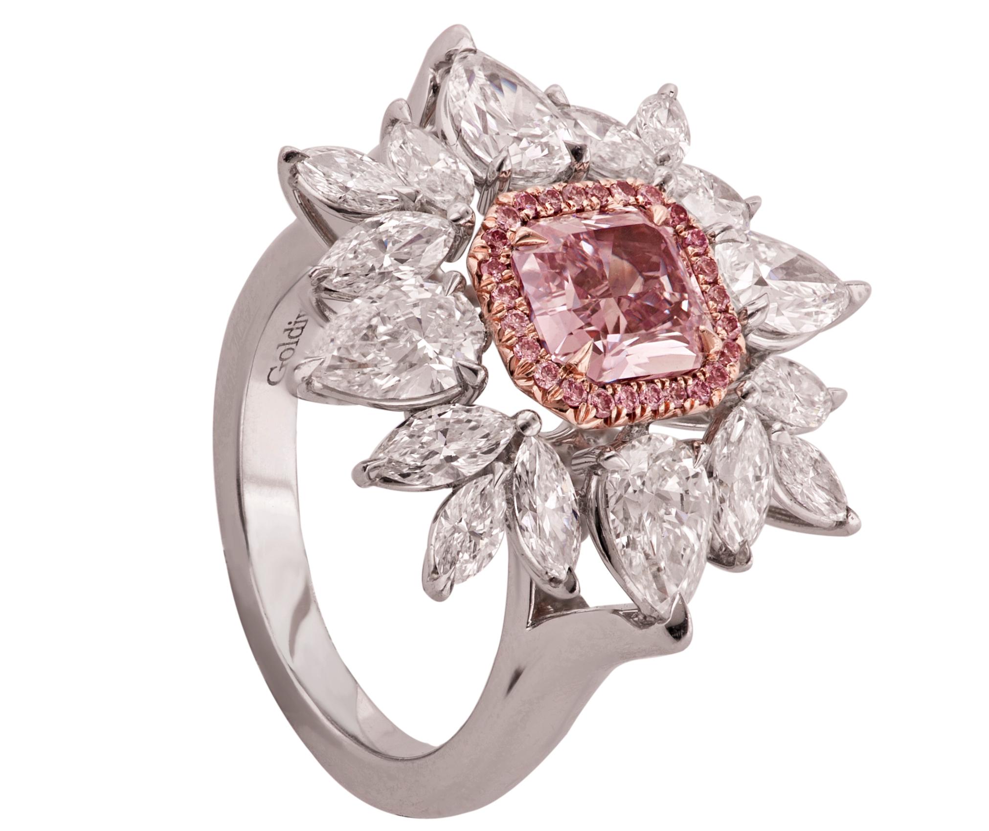 1.28 CT fancy purple pink diamond SI1 clarity in the center surrounded by 3.50 ct of marquise and pear shape stones 
