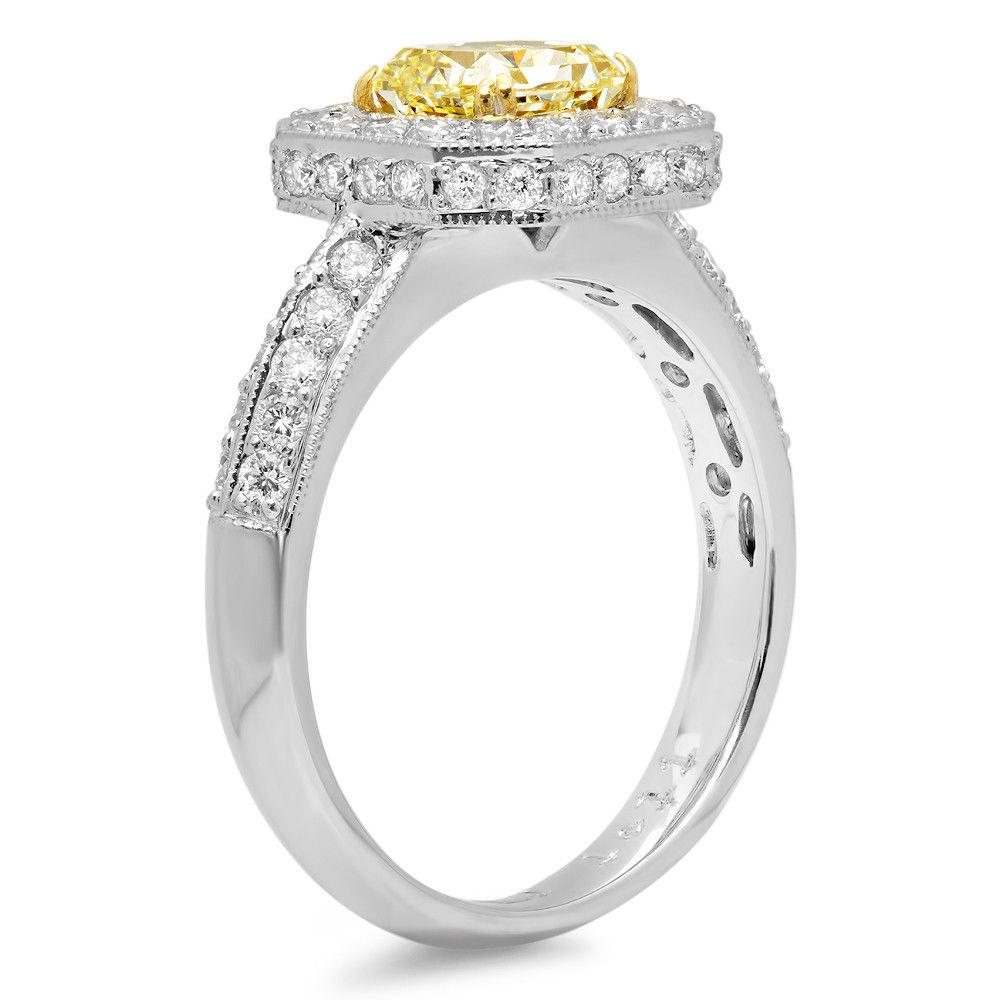 Gorgeous 18k Gold Ring Featuring Fancy Yellow Radiant Solitaire Diamond (1.11 ct, VS2 clarity) and 60 Round Diamond Accents (Total Diamond Weight = 0.84 ct, G - H color, VS1 - SI1 clarity)
Ring Size: 7
Total Mass = 5.70 grams
Includes EGL