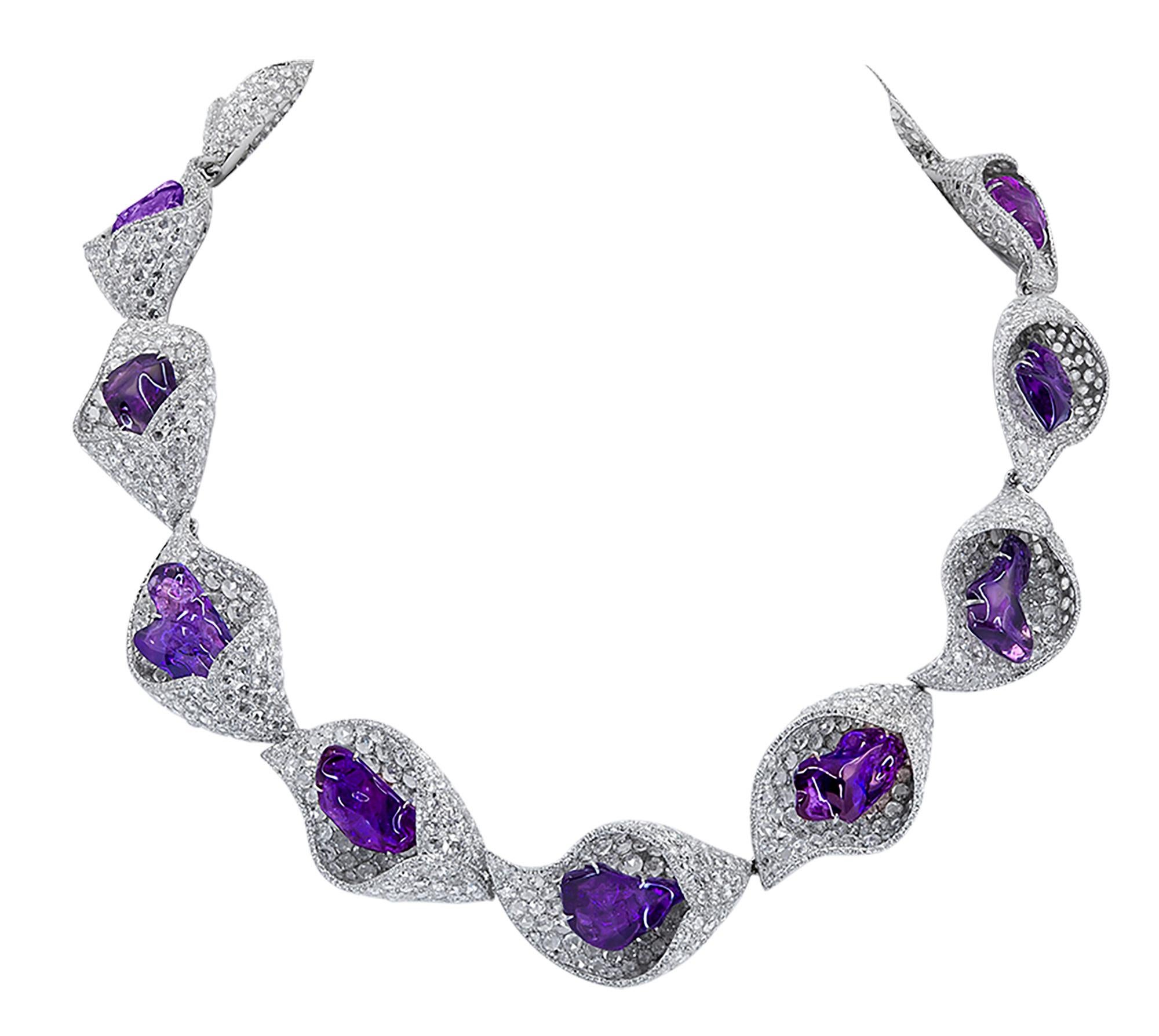 An absolutely stunning and unique necklace and bracelet set comprising of fancy sapphires and white diamonds, created by Forms Hong Kong. 

The cuff bracelet is featuring 9 fancy sapphires weighing  81.50 carats total.
There are 3,300 diamonds