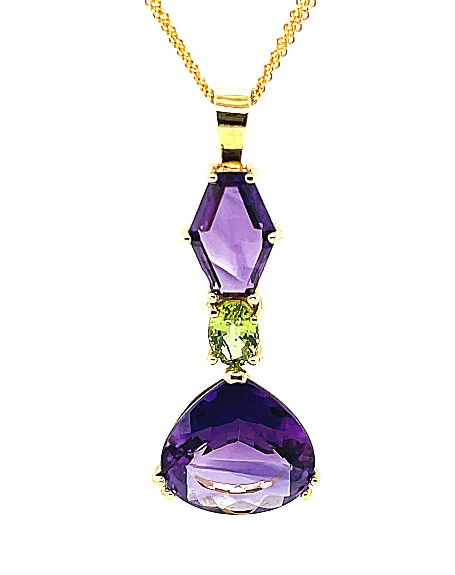 This lovely pendant has such a fun spirit! Fancy shaped colorful gemstones make this striking necklace a 