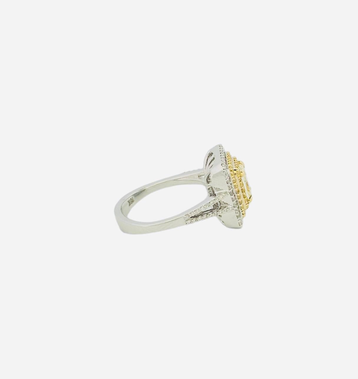 The stunning Yellow Cushion Shape Diamond Ring is a work of art that skillfully combines traditional elegance with modern craftmanship. A dazzling 1-carat cushion-shaped yellow diamond that sparkles like a flash of sunlight is the focal point of