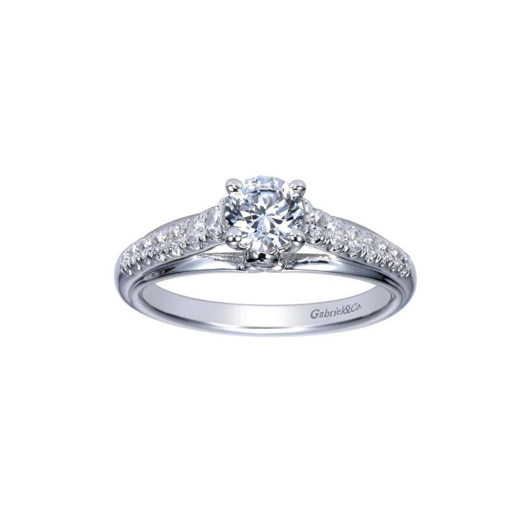 Classic Fancy Solitaire Diamond Engagement Ring﻿. Slightly graduated natural white diamonds line up the setting, leading to the center diamond. Center diamond is included, 0.40 ct weight, I color, VS2 clarity. Side diamonds weigh 0.29 ctw, H color,