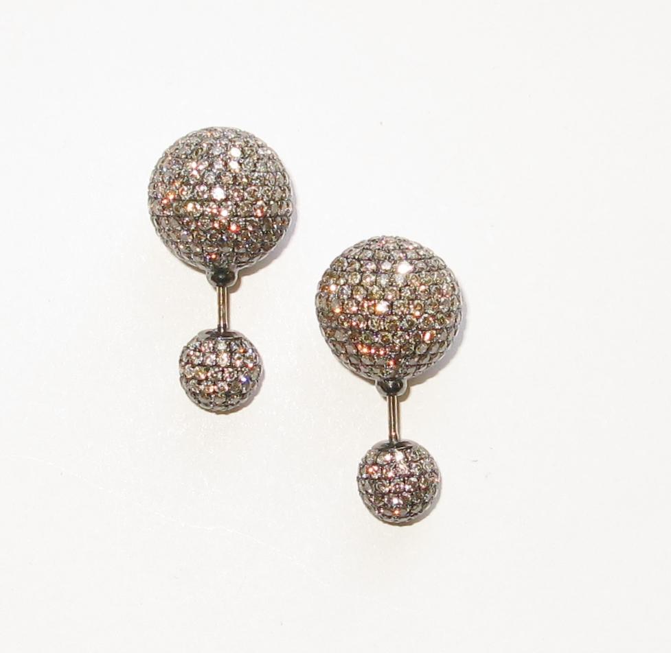 This Fancy Sparkly Brown pave diamond tribal ball earring in 14K black rhodium gold is just a rocking earring.

Pave Ball Size: 8-14mm

Closure: Push

14kt: 12.08gms
Diamond: 8.1cts