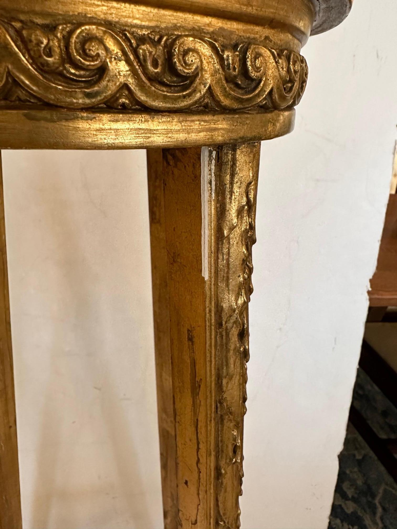 Lovely elongated tall Stand for a plant or objet d'arte having fancy giltwood and round marble inset top.