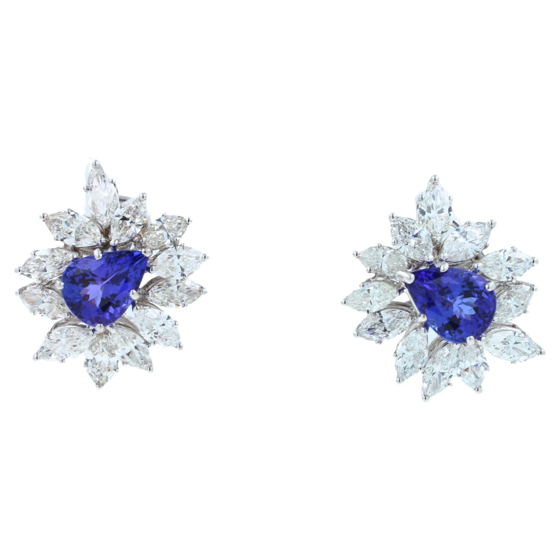 18K White Gold
8 Carats Violet - Blue Pear Cut - Drop Shape Tanzanites
13.00 ctw - G/VS diamonds 
15 grams
24 mm length earrings 

