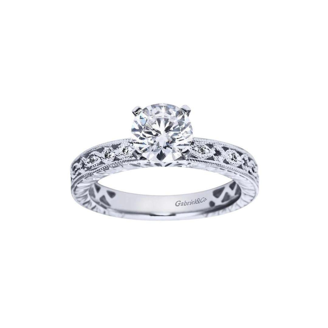 Fancy Tiffany Style Rope Design Diamond Engagement Mounting. Vintage inspired rope design weaves around the ring's diamond studded shoulders. Center diamond NOT included. Side diamonds weigh a total carat weight of 0.14 ctw, H color, SI clarity.