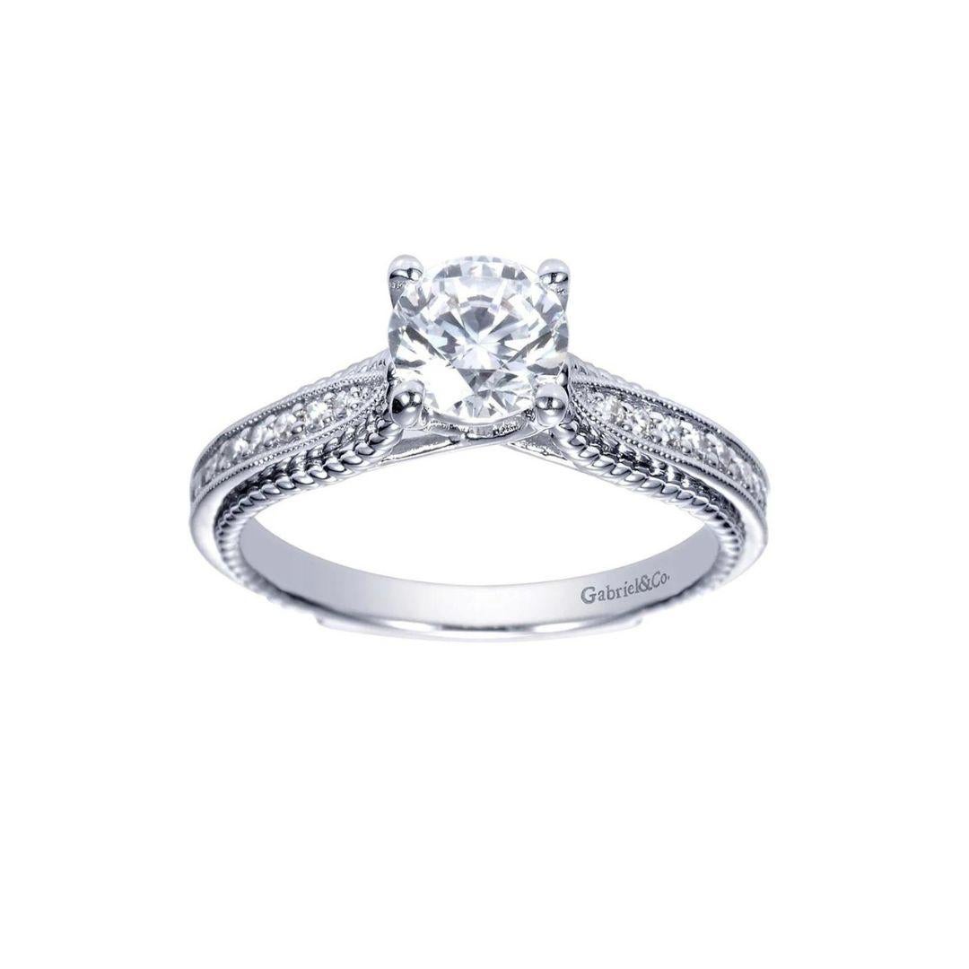 Fancy Tiffany Style Rope Design Diamond Engagement Mounting. Vintage inspired rope design weaves around the ring's diamond studded shoulders. Center diamond NOT included. Side diamonds weigh a total carat weight of 0.14 ctw, H color, SI clarity.