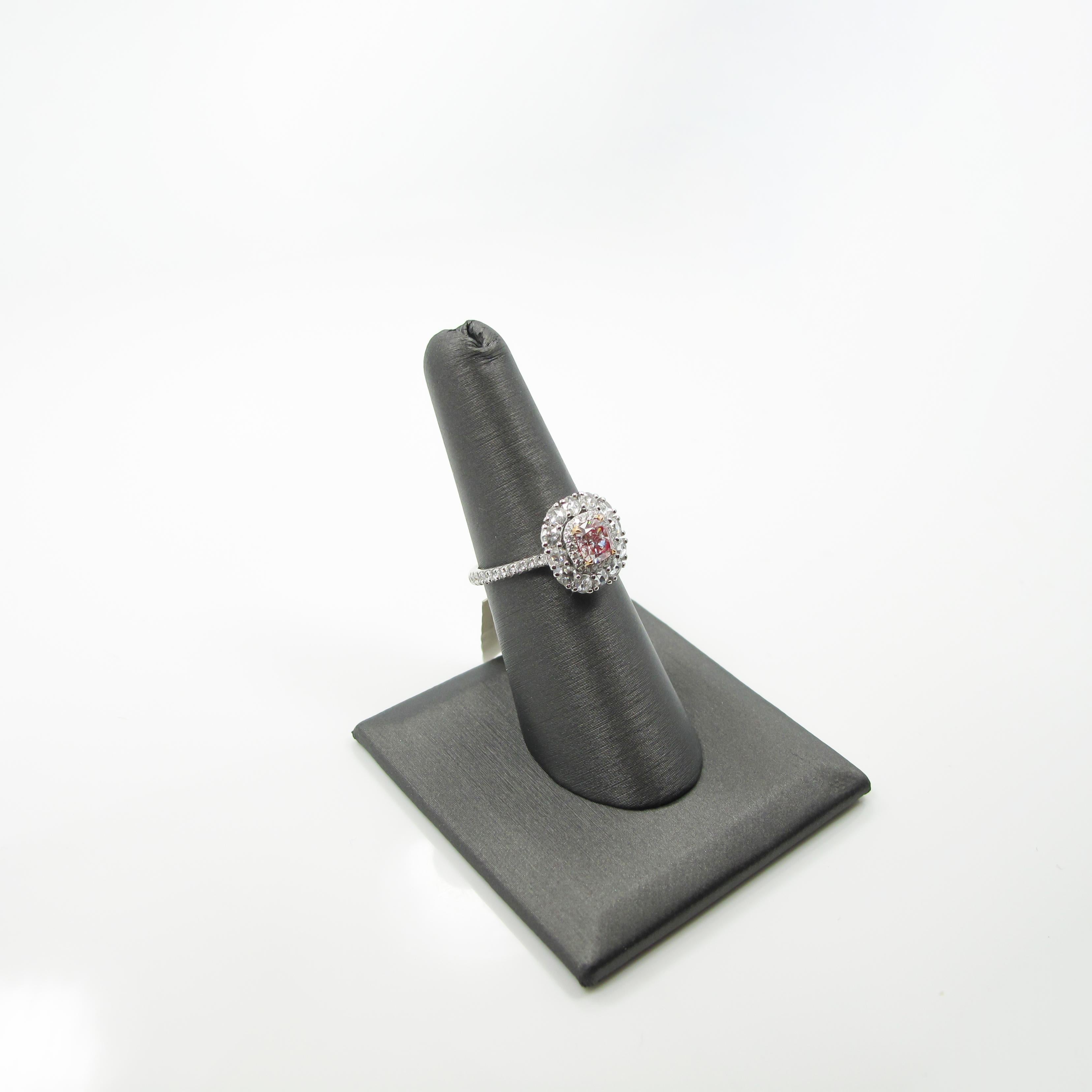 The ring features a 0.71ct. very light pink (but very nice color in person!) cushion modified brilliant diamond measuring approximately 5.21x4.95x3.42mm and accompanied by GIA certificate #5191685045.  The cushion is set in an 18k white gold basket