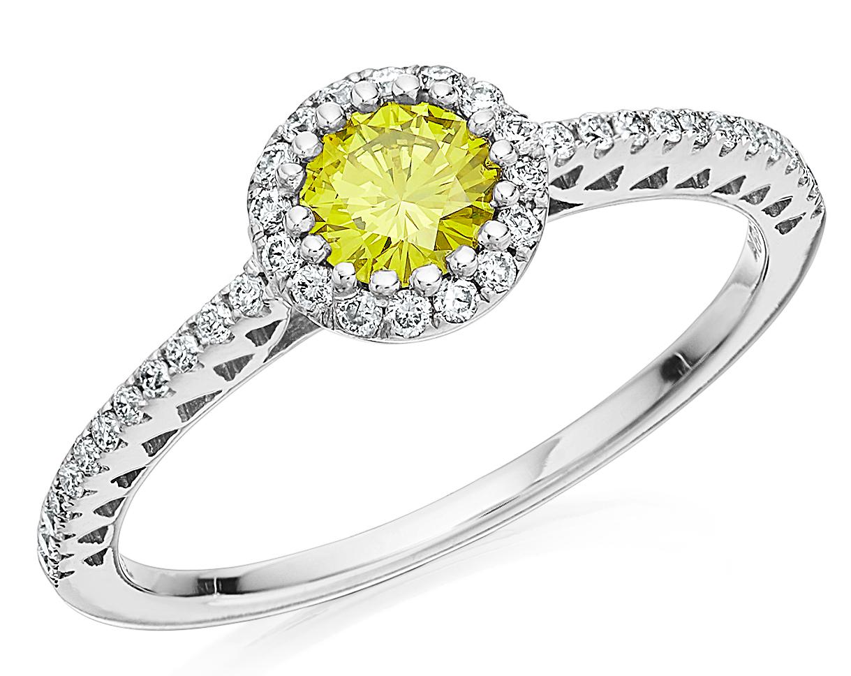 Yellow diamond and white diamond cluster ring consisting of a very slightly greenish yellow diamond as main eye-catcher, further surrounded with white diamond and completed with more diamonds on the shoulders.
1 X Fancy Vivid Yellow Diamond Round