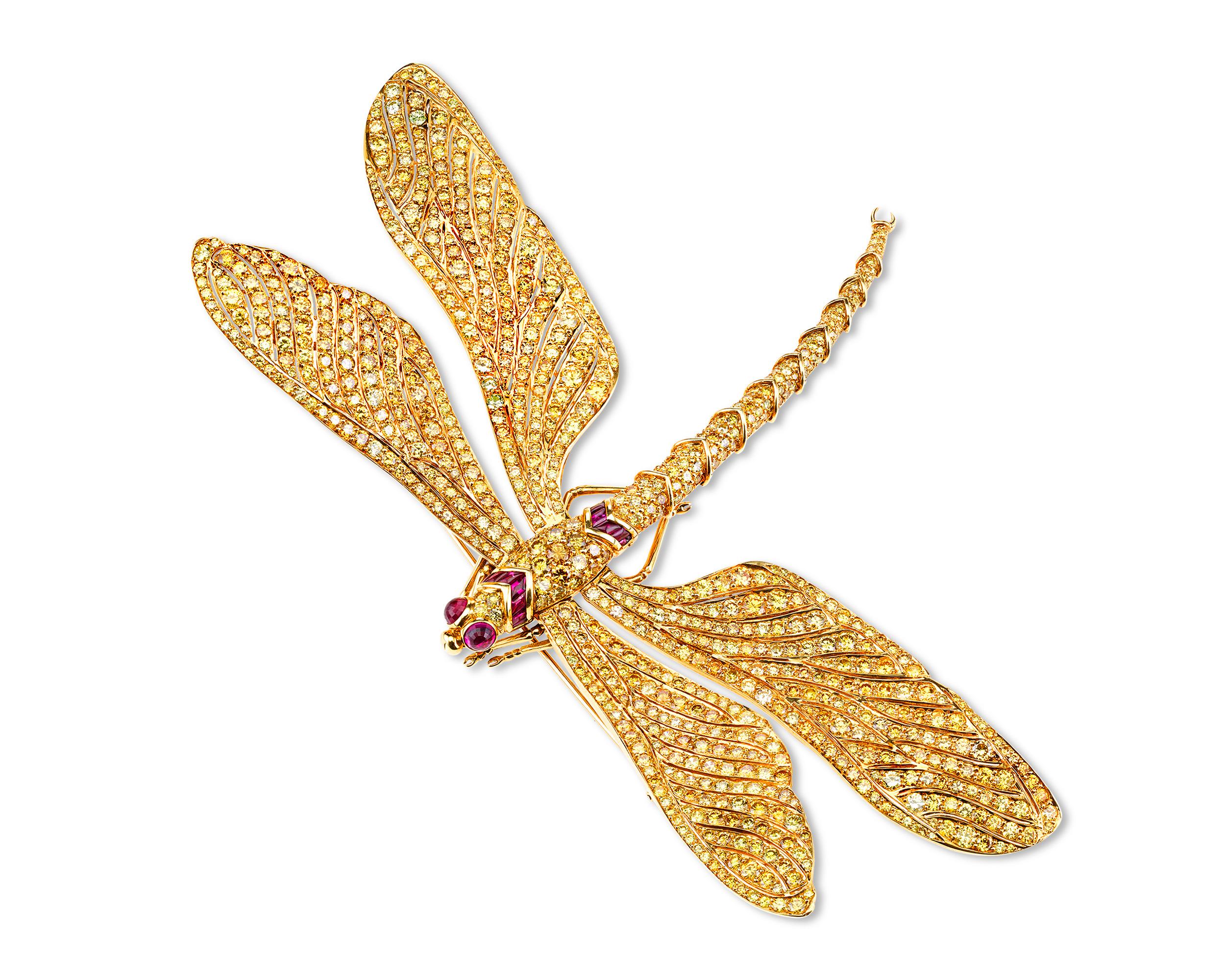 Enveloped in a sea of 60.26 carats of fancy vivid yellow diamonds is this tour de force of jewelry craftsmanship from the collaboration of jewelry legends Fred Leighton and Carvin French. Made for Patricia Kluge, then-wife of the billionaire founder
