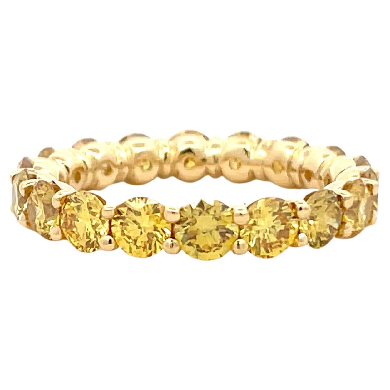 18 Karat Yellow gold eternity wedding ring featuring 18 Fancy Vivid Yellow diamonds weighing 3.45 Carats.
Average Diamond 0.19 Carats
Beautiful & Sparkles Unbelievable! 