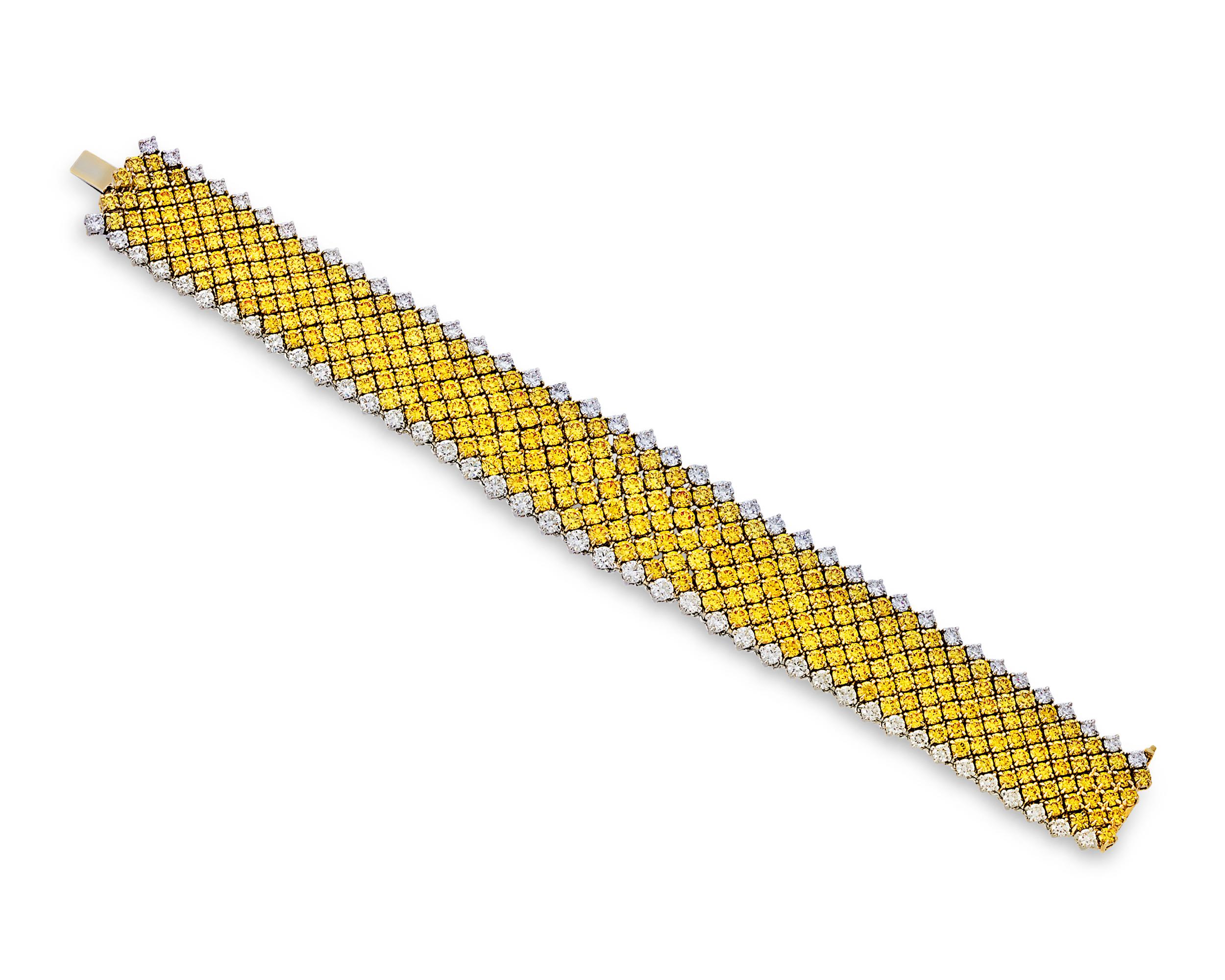 This exquisite bracelet includes an array of beautifully matched fancy vivid yellow diamonds totaling 28.40 carats. The sunny yellow diamonds are bordered by 7.43 carats of white diamonds. These brilliant jewels are meticulously fit together within