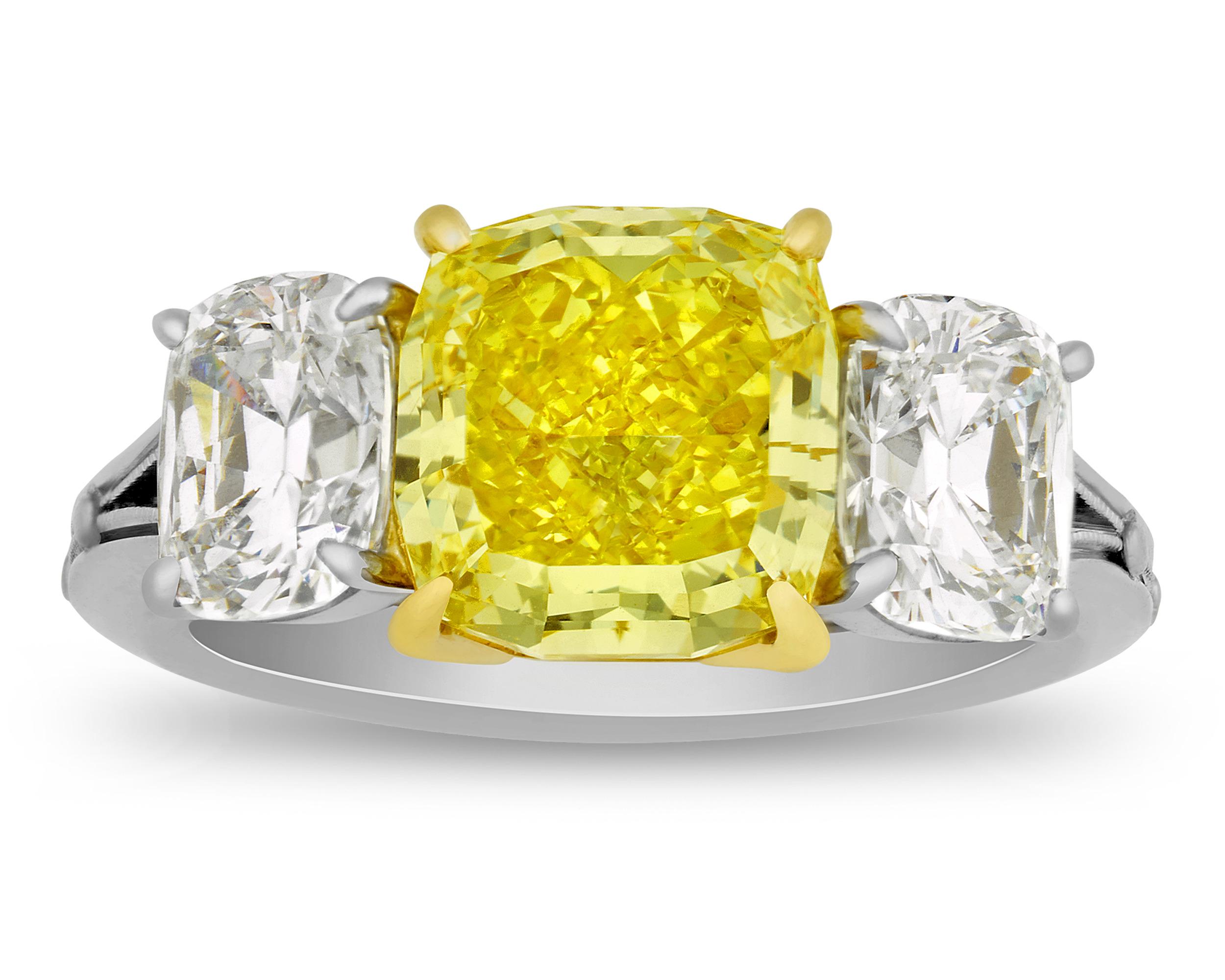 A dazzling 3.70-carat fancy vivid yellow diamond displays an extraordinary yellow hue in this ring. The mixed-cut diamond is certified by the Gemological Institute of America as Natural Fancy Vivid Yellow, the highest color grade in the realm of