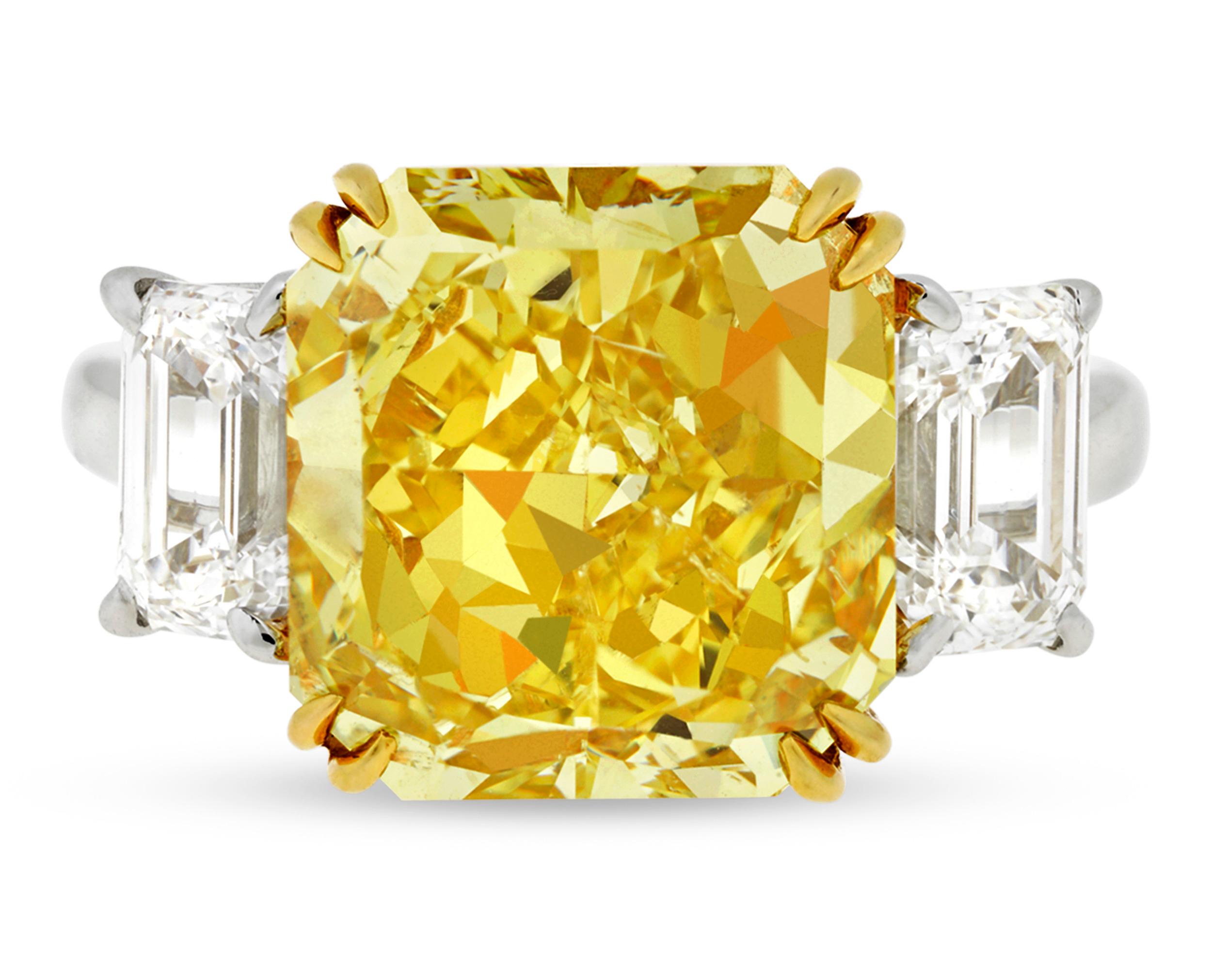 This spectacular Harry Winston ring is set with an absolutely extraordinary 7.72-carat fancy vivid yellow diamond of breathtaking beauty. The rare stone is GIA-certified as Natural Fancy Vivid Yellow, and its highly saturated color displays