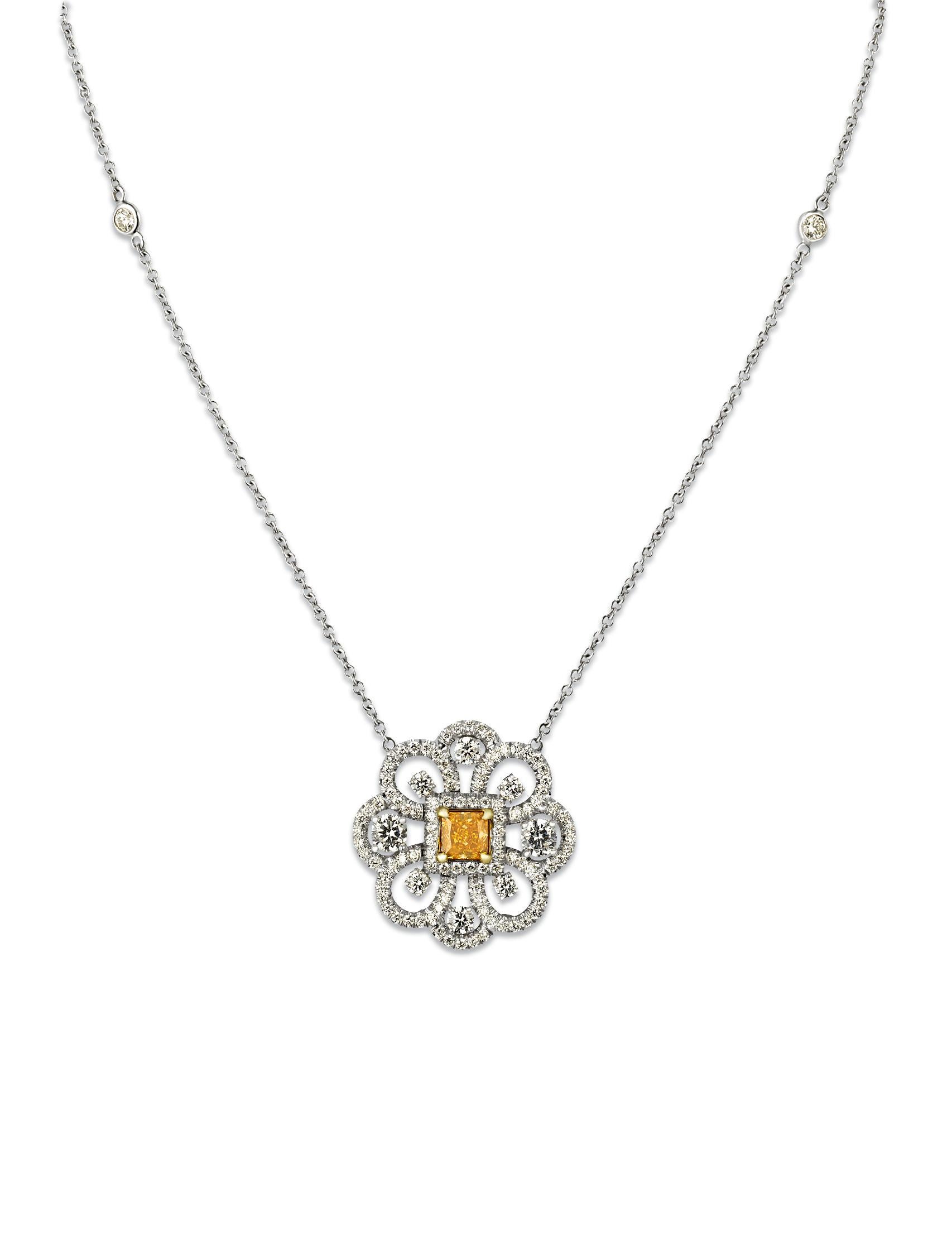 This charming pendant features a 0.43-carat fancy vivid yellowish orange diamond at its center. The rare stone is certified by the Gemological Institute of America (GIA) and has undergone no enhancements to achieve its distinctive color. Its
