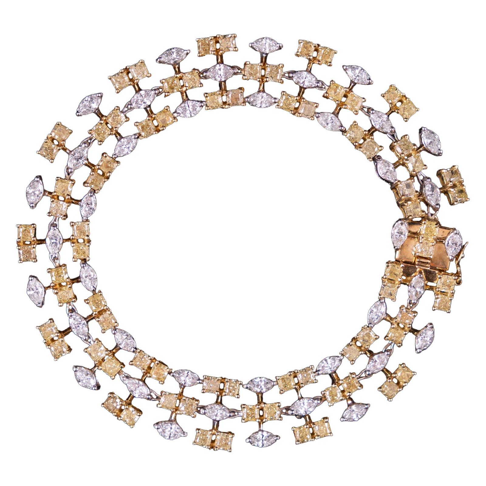 Bracelet en or bicolore jaune et blanc 18 carats, orné de diamants fantaisie jaunes et incolores