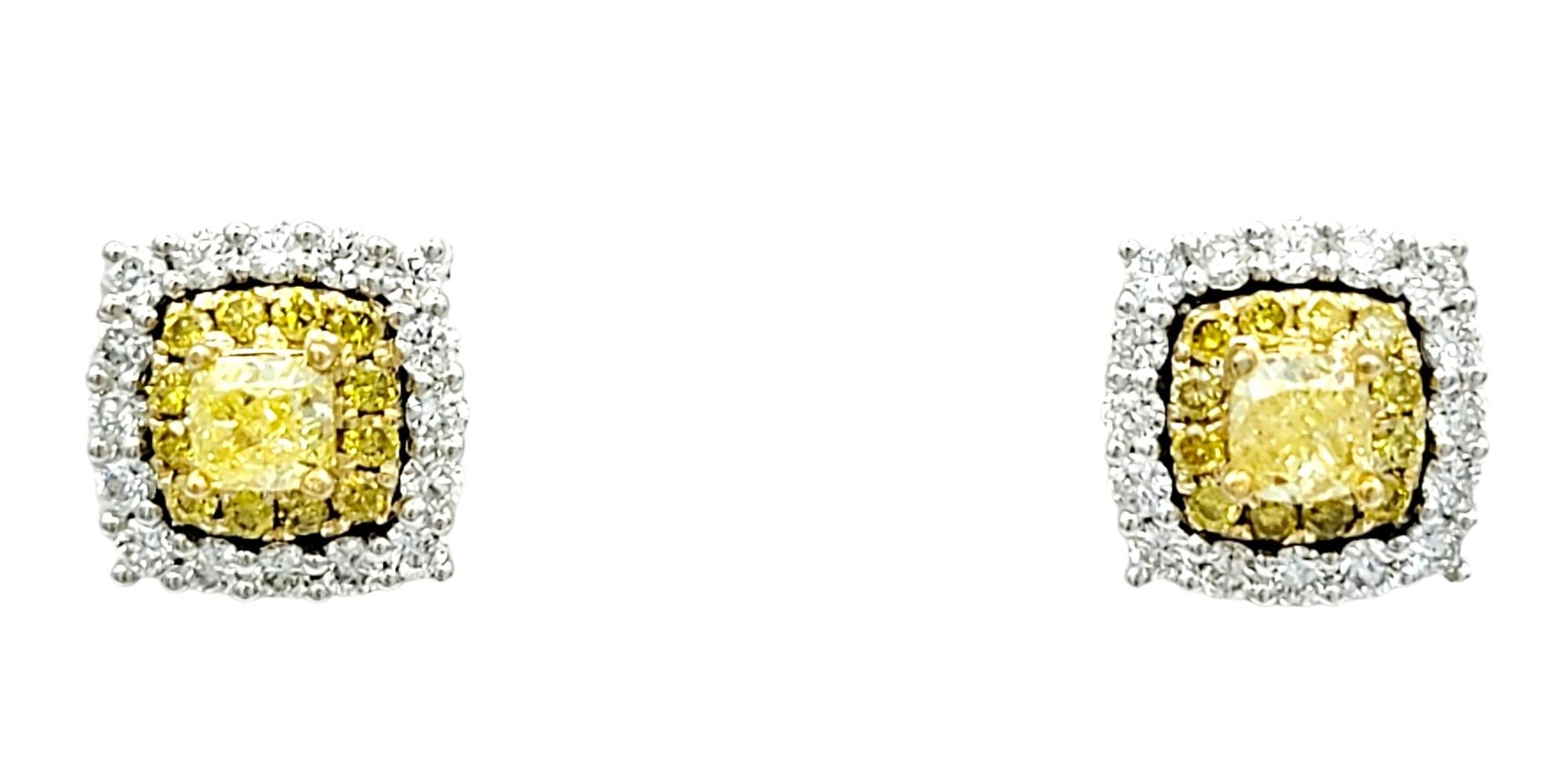These stunning diamond stud earrings are a dazzling display of elegance and sophistication. Each earring boasts a brilliant, fancy yellow cushion-cut diamond, securely cradled in a four prong setting. These radiant yellow diamonds are the stars of