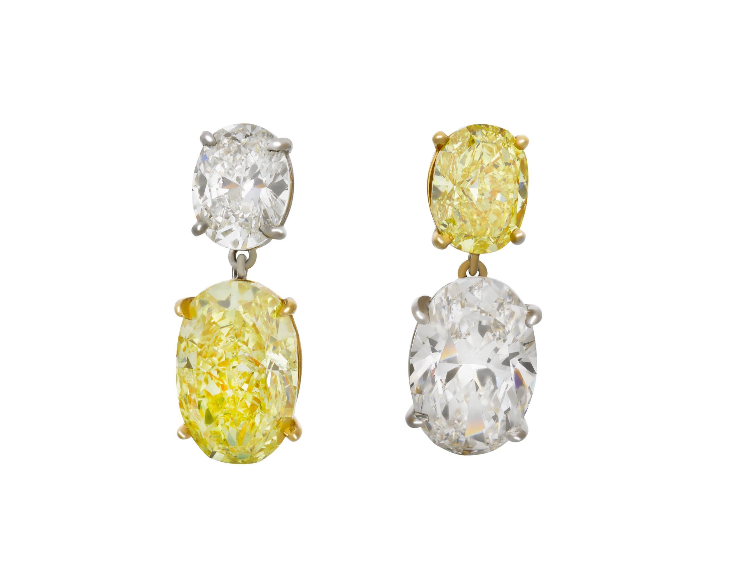 Two natural fancy yellow diamonds totaling 3.62 carats are set in these dazzling earrings. The gems, which weigh 2.54 and 1.08 carats, are certified by the Gemological Institute of America as entirely natural. The larger of the two is fancy intense