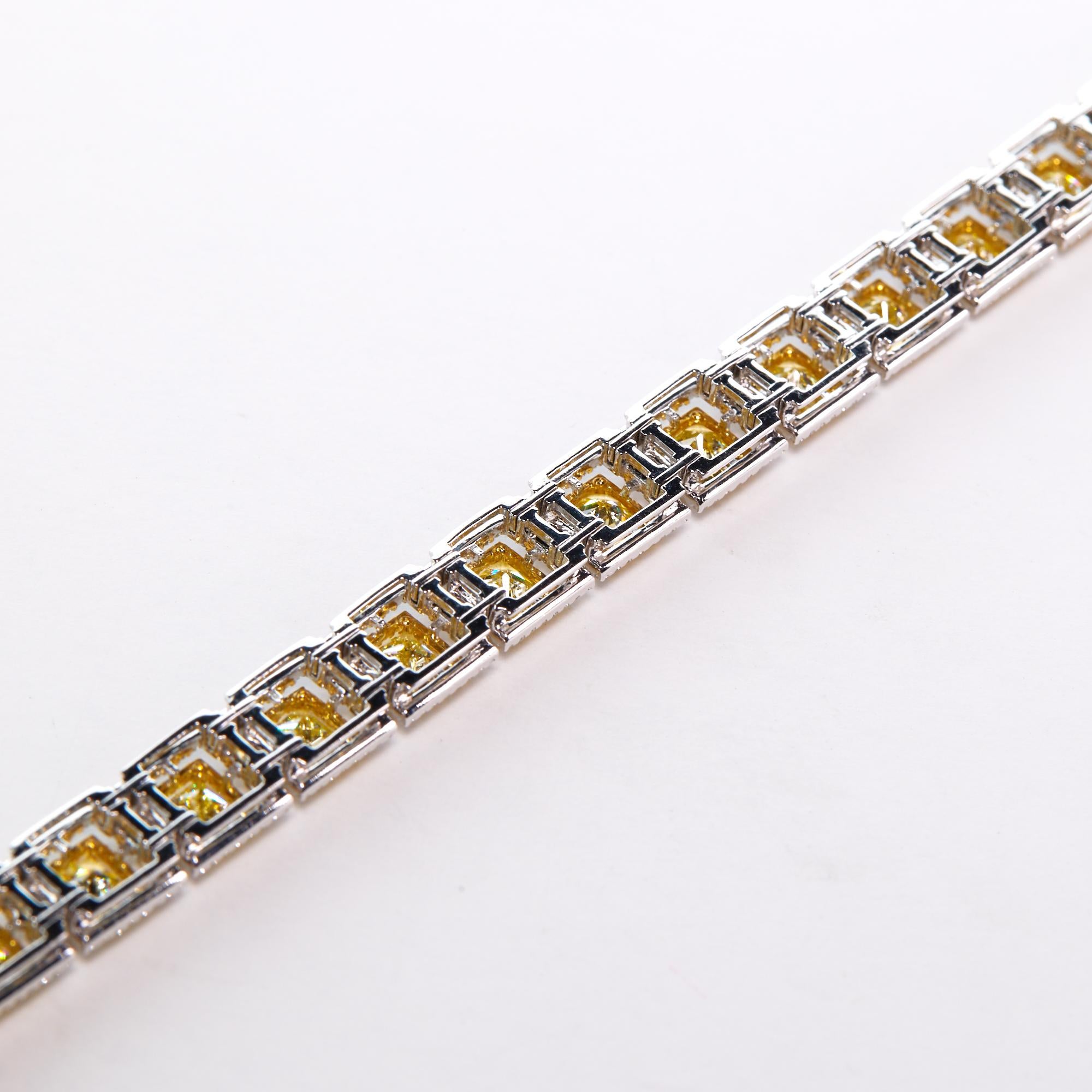 Fancy Yellow And White Diamond Modern Bracelet.  This modern tennis Bracelet has 13.36 carats of fancy yellow Princess cut diamonds, 1.59 carats of fancy yellow diamonds generously surround the larger stones, and 1.97 carats of round brilliant white
