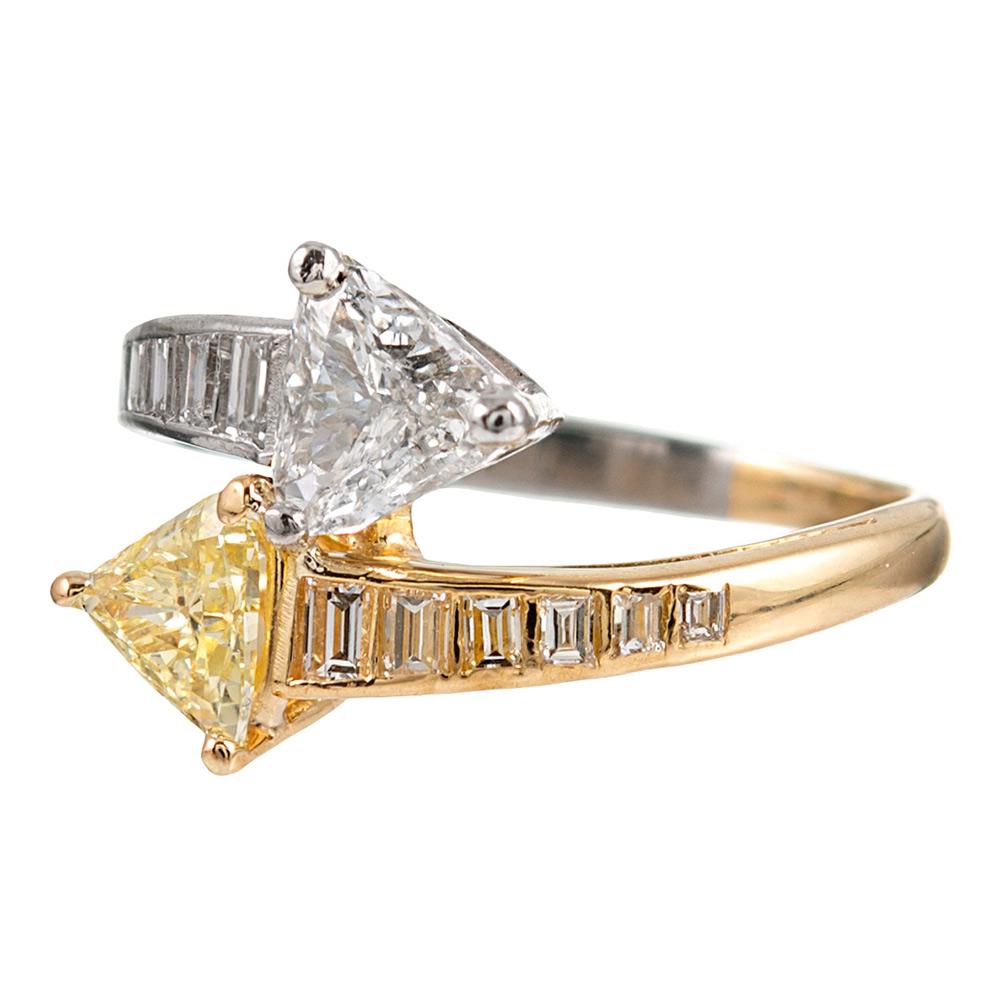 Adorable finery is achieved by opposing arrows of fancy yellow and white diamond trillions. Ideally sized for a pinkie ring (the ring is currently a 3.25, but can be resize on request), this sweet and whimsical creation will certainly have special