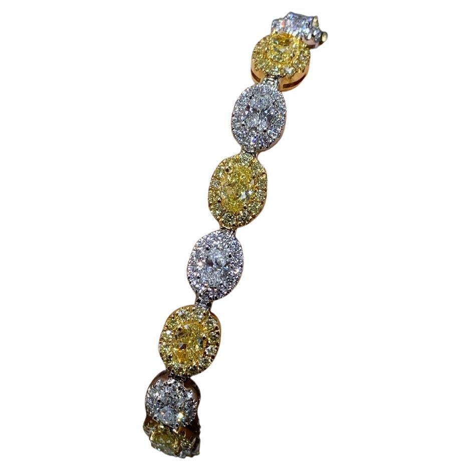 Splendid 9.10 carats diamond fancy yellow tennis bracelet will make her shine with glory once you put it on her wrist. Absolutely gorgeous setting and with round and oval shape diamonds will sit comfortably on her wrist without ever breaking.
Metal: