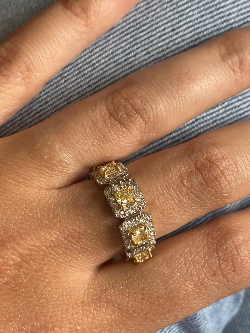 8 Yellow Diamonds weighing 1.96 Carats
96 Round White Diamonds weighing 1.44 Carats
Set in Platinum and 18 Karat Yellow Gold.
Size 6.75
Can be resized