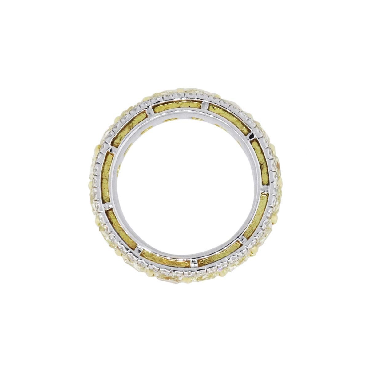 Material: Platinum and 18k yellow gold
Diamond Details: Approximately 8.80ctw of fancy yellow cushion cut diamonds. Approximately 1.10ctw of round brilliant diamonds. White diamonds are G/H in color and VS in clarity.
Ring Size: 7
Total Weight: