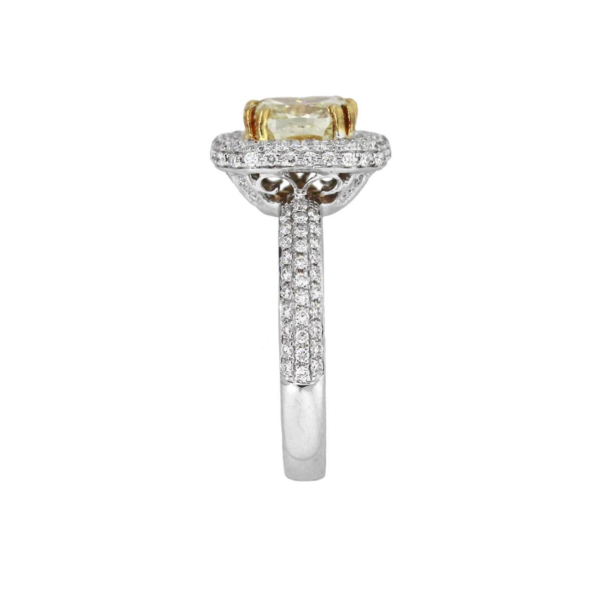 Material: 18k White Gold/18k yellow gold
Center Diamond Details: Approx. 2.01ct cushion diamond. Diamond is Fancy Yellow in color and SI in clarity
Adjacent Diamond Details: Approx. 0.81ctw of pave set round brilliant diamonds. Diamonds are G/H in