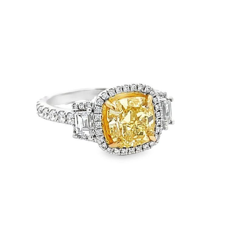 Prepare to be amazed by the stunning beauty of this bridal ring! This exquisite piece of jewelry features a gorgeous display of white diamonds in perfect balance with yellow. The center stone is a magnificent cushion fancy yellow diamond weighing
