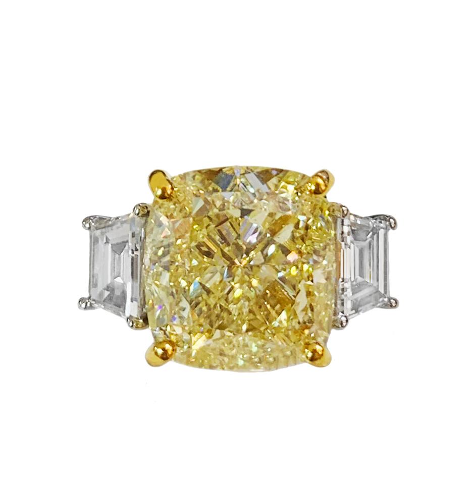 -14k White Gold

-Ring size: 6.5

-Fancy Yellow Diamond: 7.01ct, VS2

-Symmetry: Very good, Polish: Excellent

-Yellow Diamond dimension: 10x10mm

-White Diamond: side stones, 0.5ct each, VVS/E-F

-Comes with GIA certificate