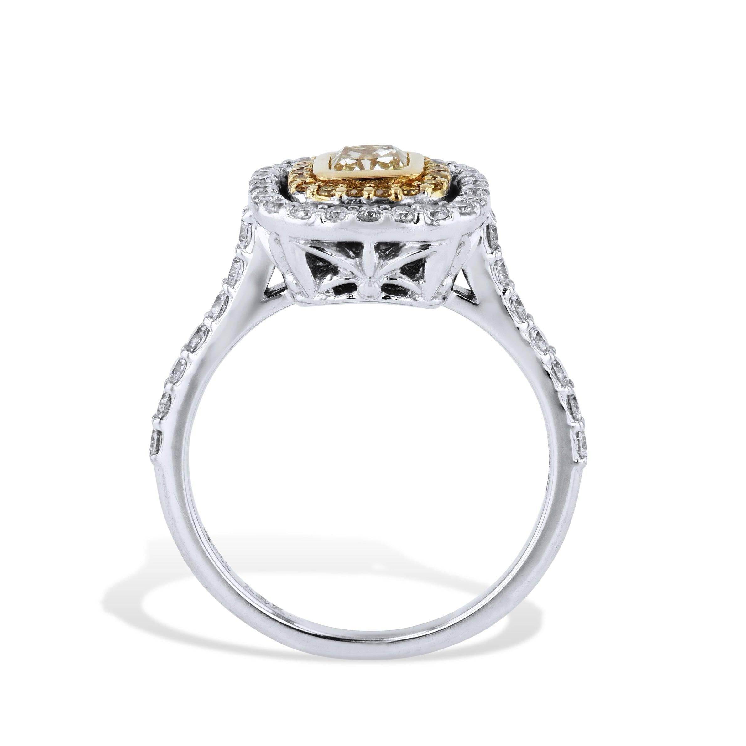 Indulge in this extraordinary Fancy Yellow Diamond and Pave Estate Engagement Ring crafted in 18kt white and yellow gold. Adorned with a radiant cut Fancy Yellow Diamond and alluring diamond pave. This masterpiece from the Estate and Vintage
