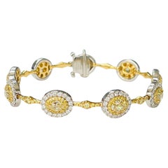 Armband aus Platin und 18 Karat Gold mit gelben Diamanten und weißen Diamanten.