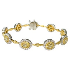Armband aus Platin und 18 Karat Gold mit gelben Diamanten und weißen Diamanten.