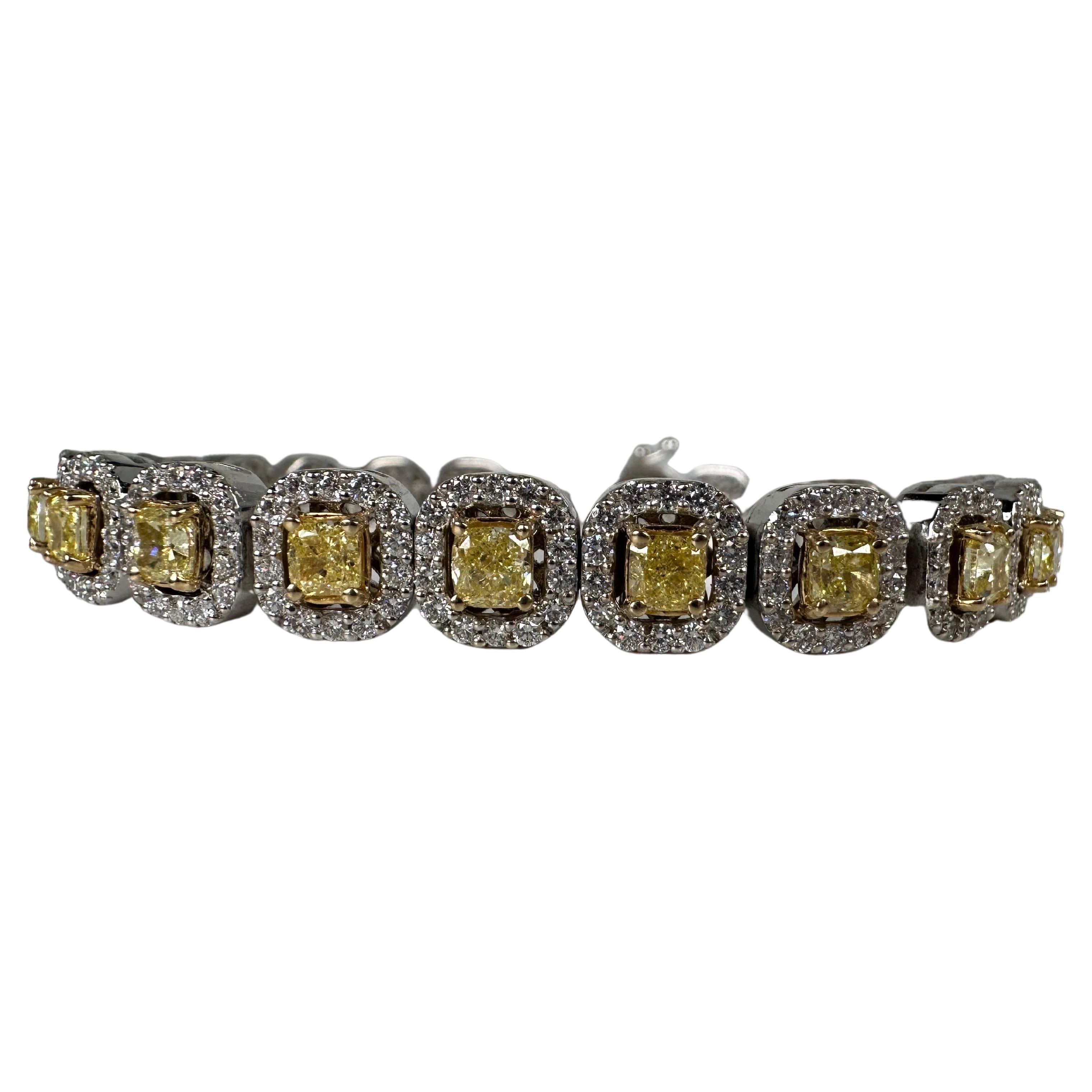 Very important fancy yellow diamonds bracelet made with 100% natural earth mined diamonds, crafted in white gold with halo design. The yellow diamonds have all been matched to perfections which makes this bracelet very unique.

GOLD: 14KT