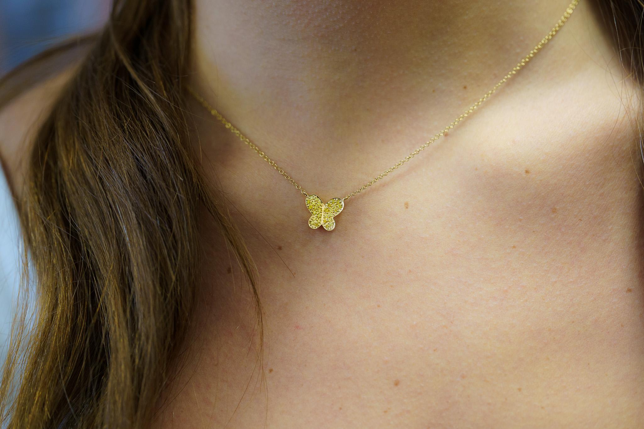 Natural Yellow Diamond Butterfly Motif Pendant Chain Necklace, gracefully nestled in lustrous 18K Solid Yellow Gold. This pendant necklace features round-cut natural yellow diamonds in a pave cluster setting, radiating gold/yellow hues.

The stones