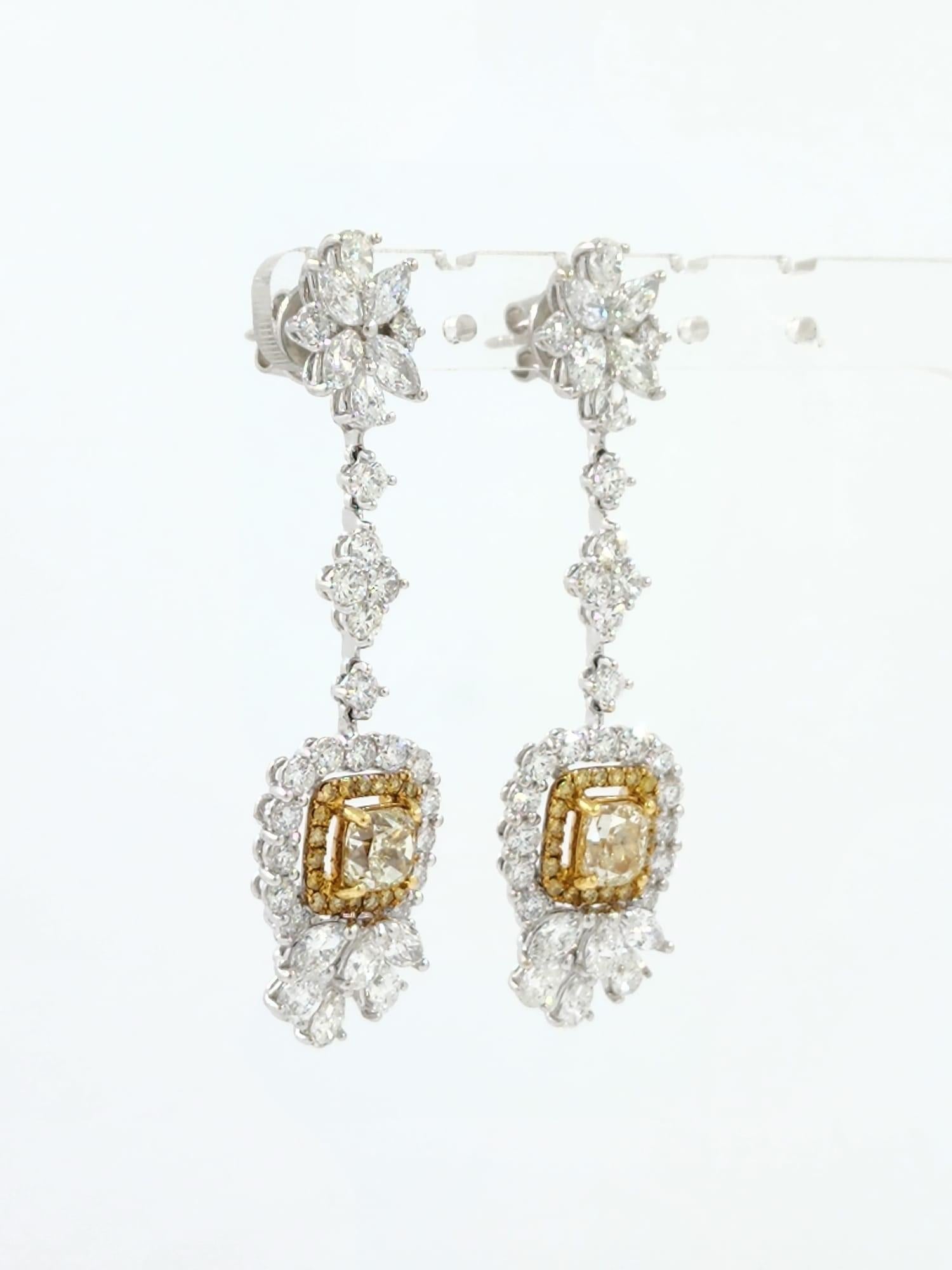 Introducing our stunning dangle earrings, the perfect addition to your jewelry collection. These exquisite earrings feature a total of 2.42 carats of brilliant yellow diamonds, which catch the light beautifully and add a pop of color to any outfit.