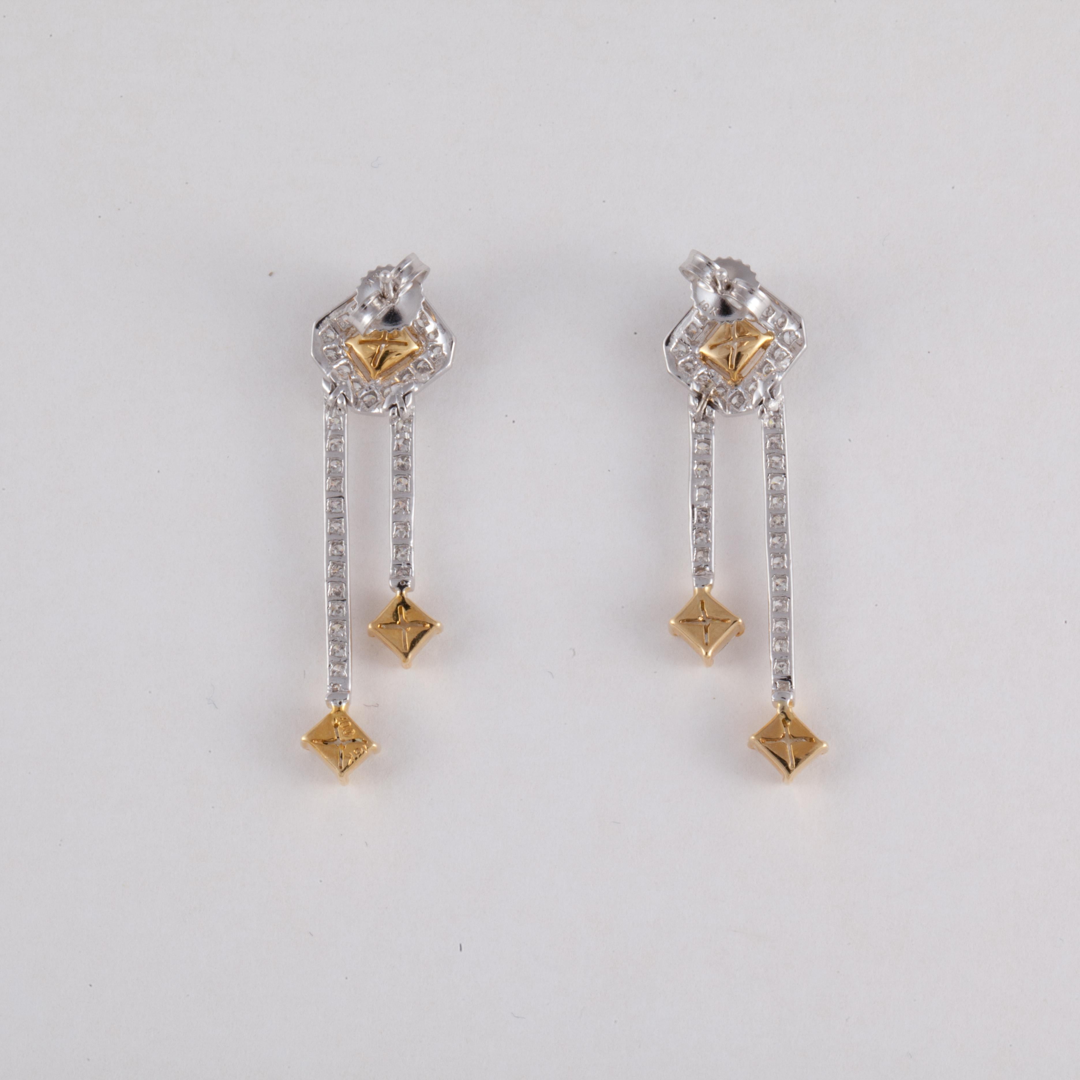 Earrings set in platinum and 18K yellow gold.  They feature six (6) fancy light yellow and fancy yellow diamonds totaling 1 .15 carats which are VS2-I1 clarity.  Additionally, there are 108 round diamonds that total 0.90 carats;  G-H color and