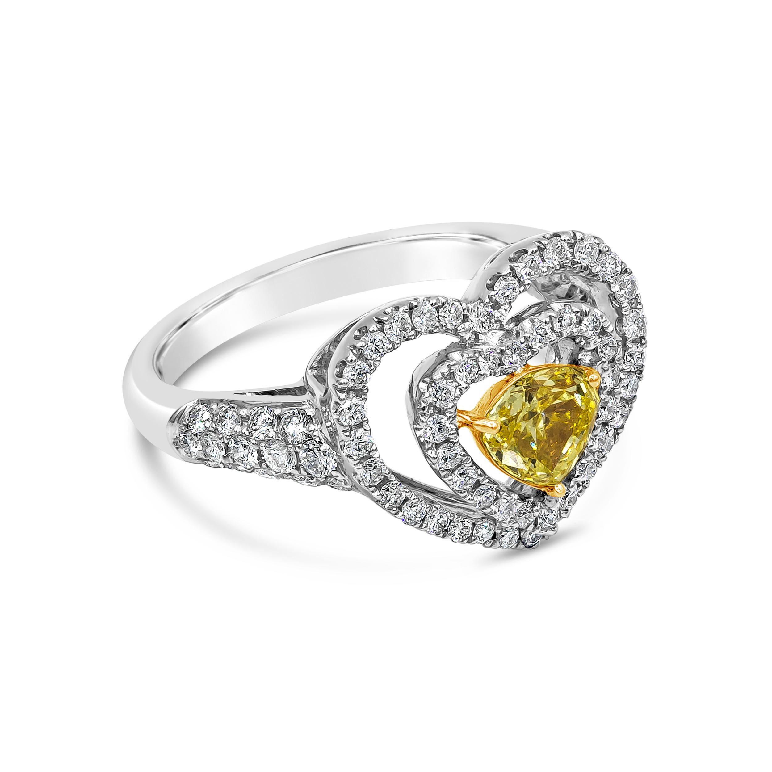 A unique and chic engagement ring showcasing a 0.58 carats yellow diamond, set in an open-work double halo design shaped like a heart. Accent diamonds weigh 0.72 carats total. Made in 18K White Gold. Size 6.5 US resizable upon request.

Roman