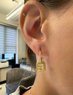 Fancy Yellow Diamond Earring with Radiant Cut Diamonds
