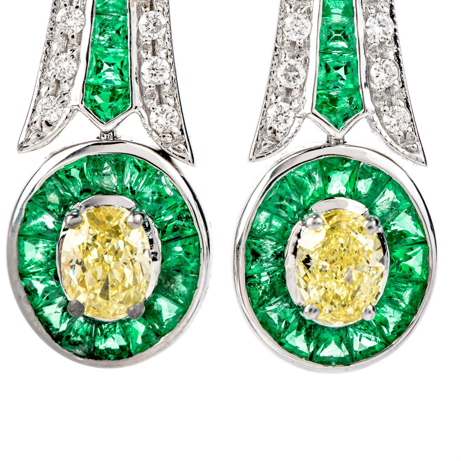 Be uniquely stunning with these Fancy Yellow Diamond & Emerald 18K Gold Oval Drop Dangle Earrings! 

These Art Deco inspired earrings are crafted in 18 karat white gold and weigh in total 8.2 grams and measure 40 long  by 10 millimeters wide . 