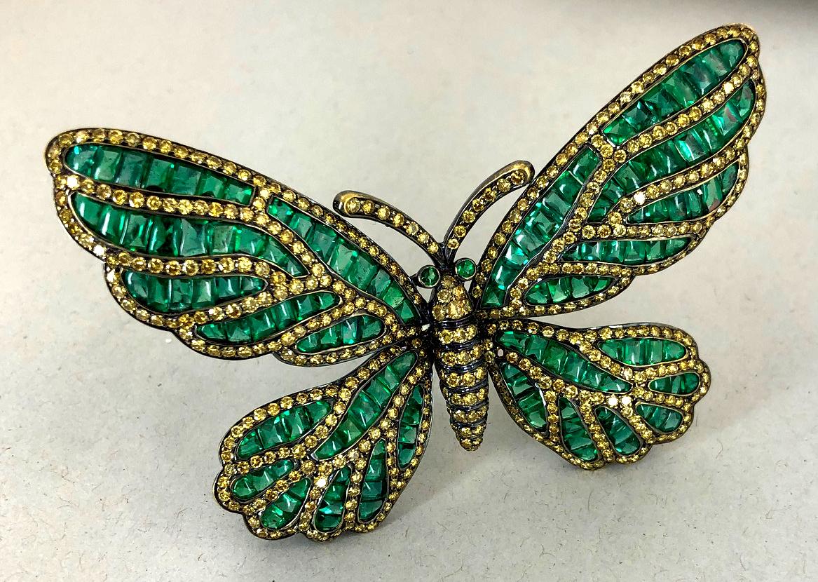Black gold butterfly brooch, set with fancy yellow diamond and emerald. Dimensions approx. 2