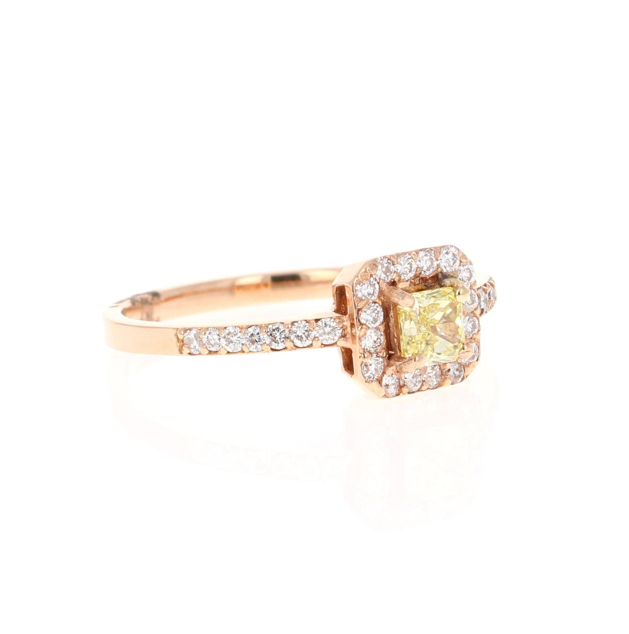 This beautiful engagement ring has a Princess Cut Yellow Diamond that weighs 0.32 carats with a VS Clarity and Color is Fancy Yellow. There are 30 Round Cut Diamonds that weigh 0.31 Carats, Clarity: VS, Color: F. The total carat weight of the ring