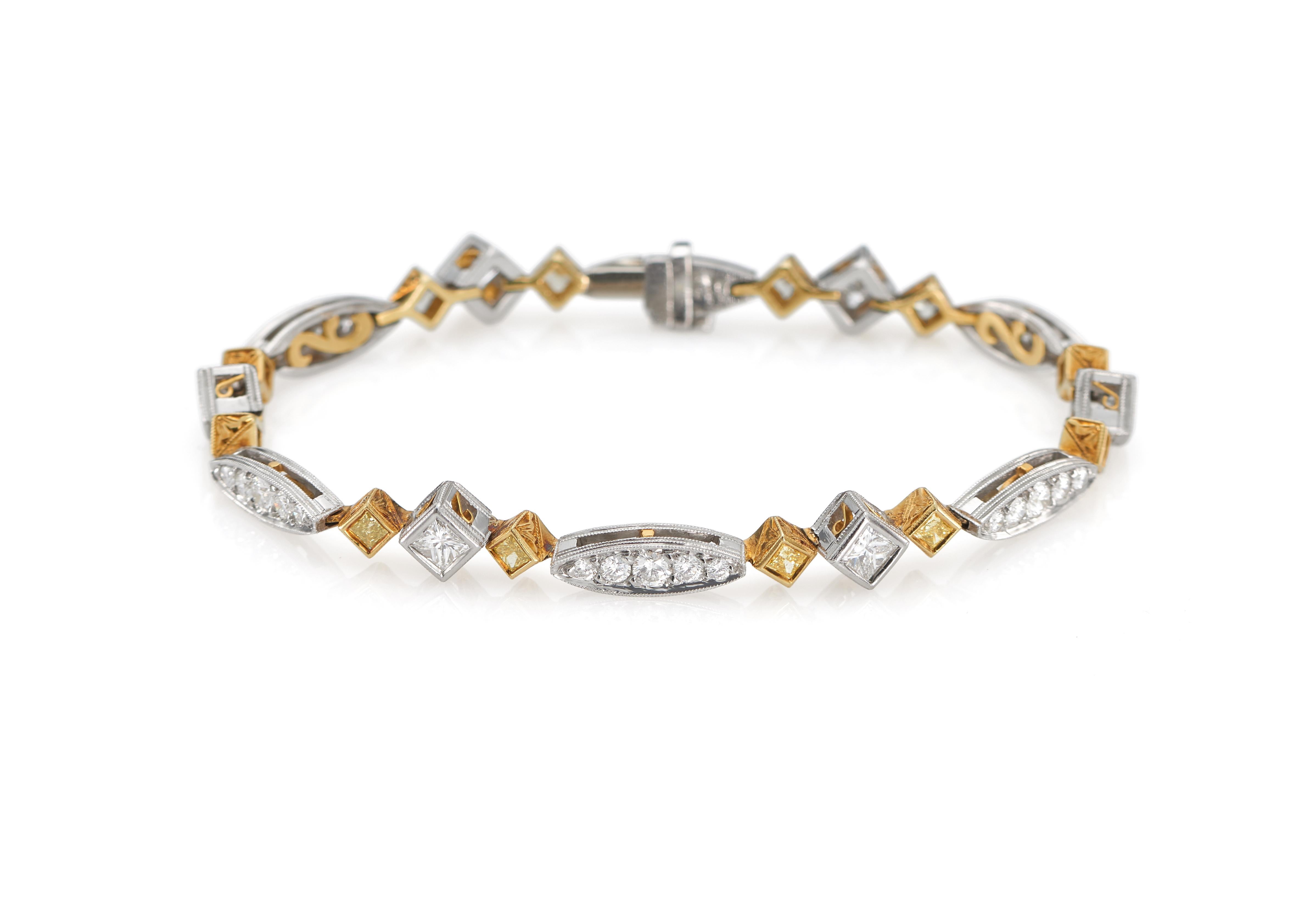 Beautiful diamond bracelet with princess-cut fancy yellow diamonds and princess-cut white diamonds, set in platinum and 18k yellow gold. 

Fancy yellow diamonds total 1.15 carats and the white diamonds total 1.45 carats.
    
Two-tone metal of