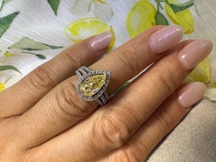 Fancy Yellow diamond halo ring 18KT white gold