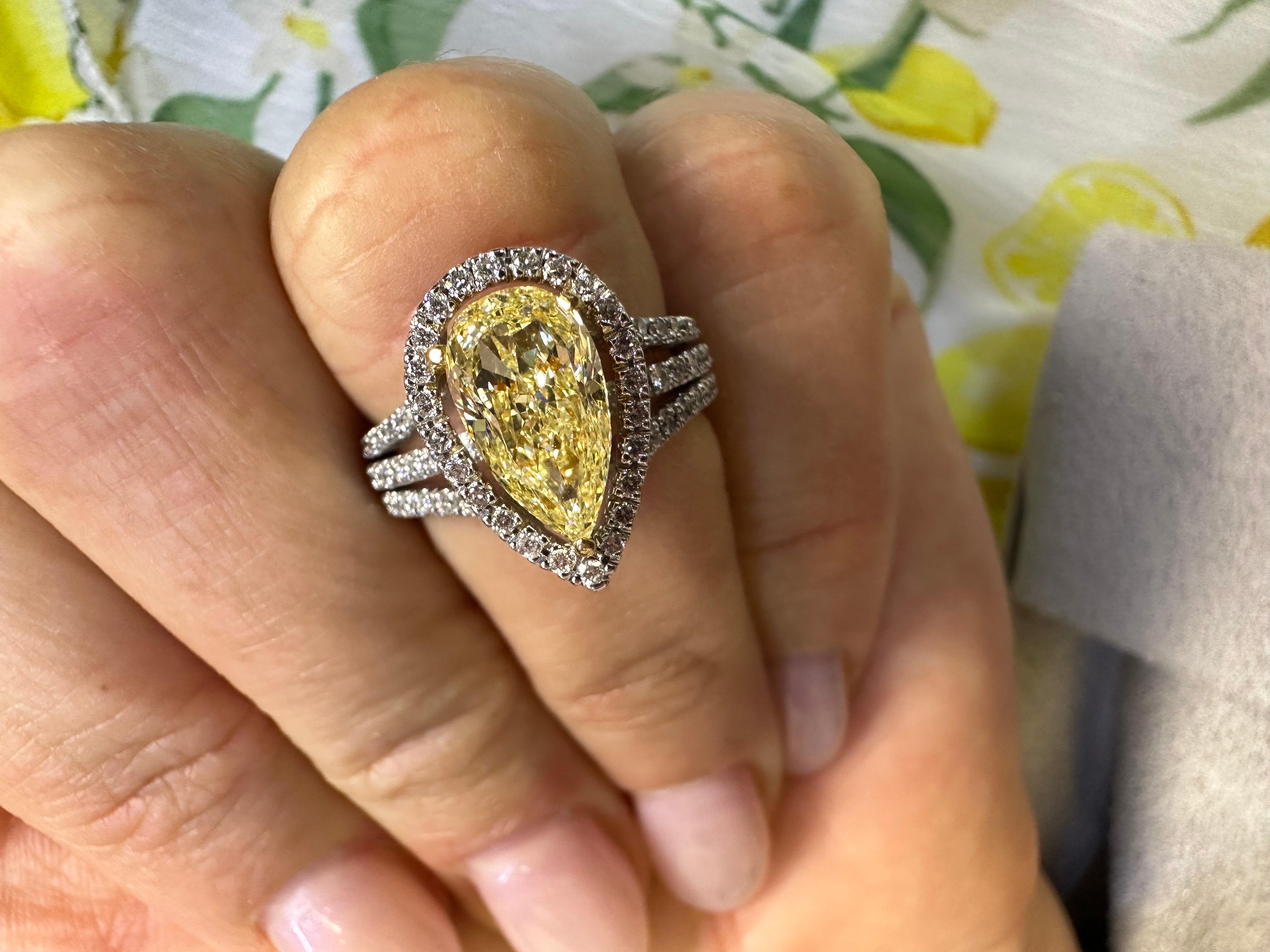 Pear Cut Fancy Yellow diamond halo ring 18KT white gold  For Sale