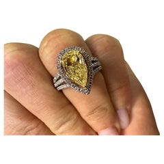 Fancy Yellow diamond halo ring 18KT white gold 